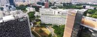 Which is bigger, the Singapore General Hospital or the Singapore National Stadium?